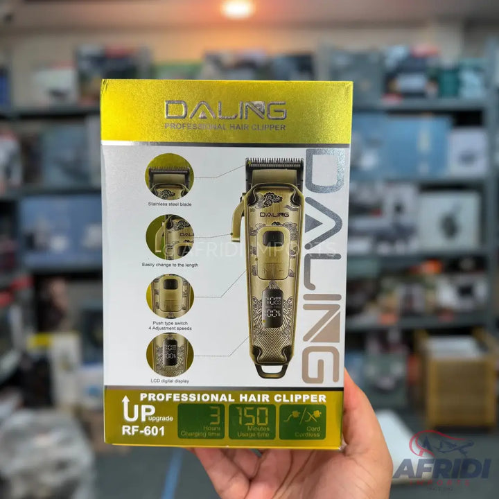 Gold-colored professional hair clipper with an LCD display, stainless steel blade, and adjustable length settings.