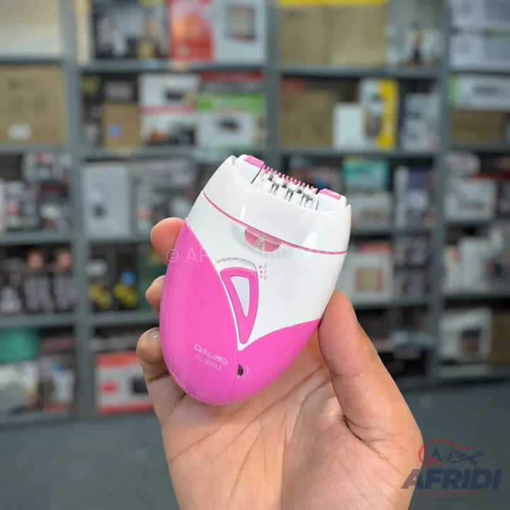 Pink and white handheld electric epilator with multiple tweezers.