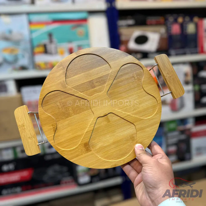 Round bamboo serving tray with five clover-shaped compartments and two handles.