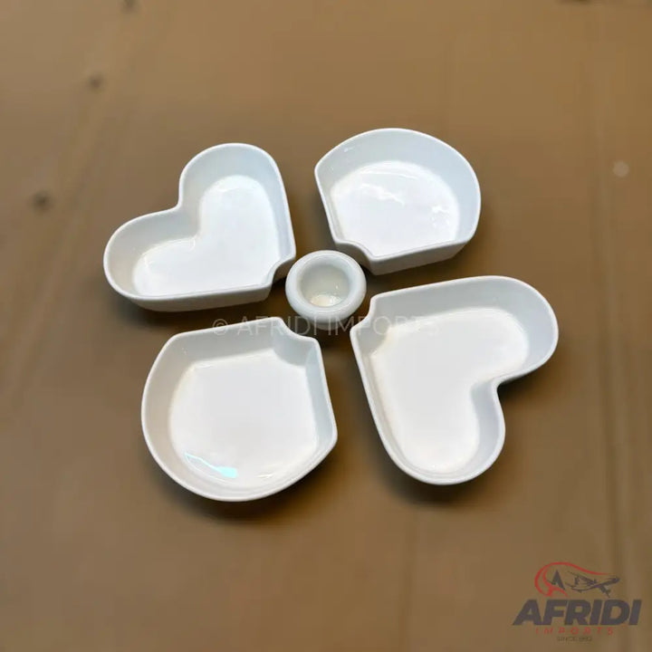 White ceramic heart-shaped snack and dip serving set.