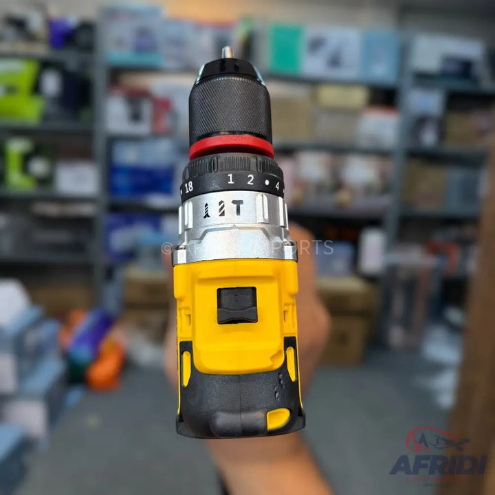 Yellow and black cordless impact drill with adjustable torque settings.