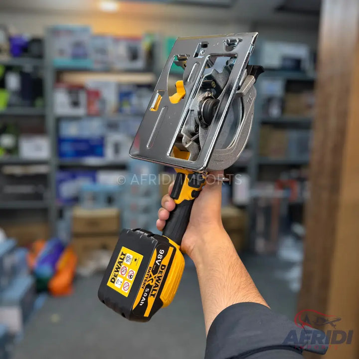 A handheld cordless circular saw with a black and yellow battery pack.