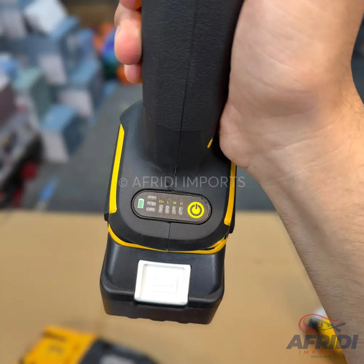 A black and yellow power tool battery with a charge indicator and power button.