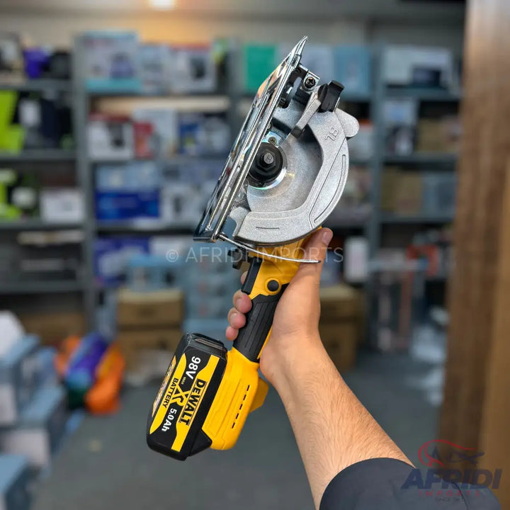 Cordless circular saw with a yellow and black battery pack.