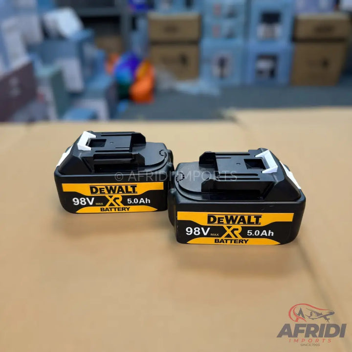Two black and yellow battery packs for power tools.