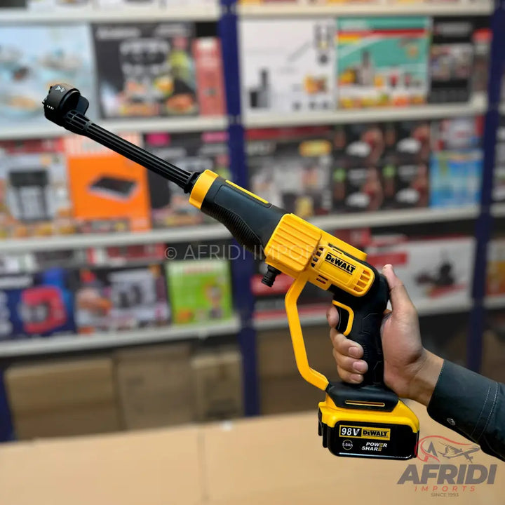 A cordless yellow and black pressure washer.