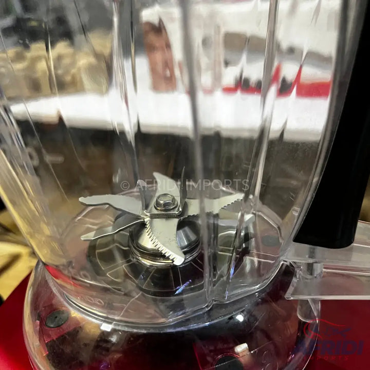 Clear plastic blender jar with a six-blade assembly.