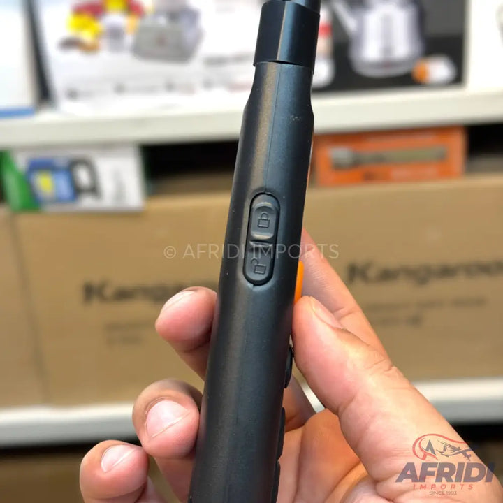 Black handheld device with lock/unlock buttons.