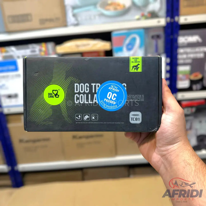 Black box for a dog training collar, featuring a ’QC Passed’ sticker and ’Dog Care’ branding.