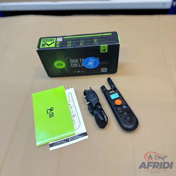Dog training collar kit with remote, charger, and instructions.