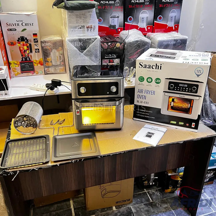 A stainless steel air fryer oven with a digital display and multiple accessories.