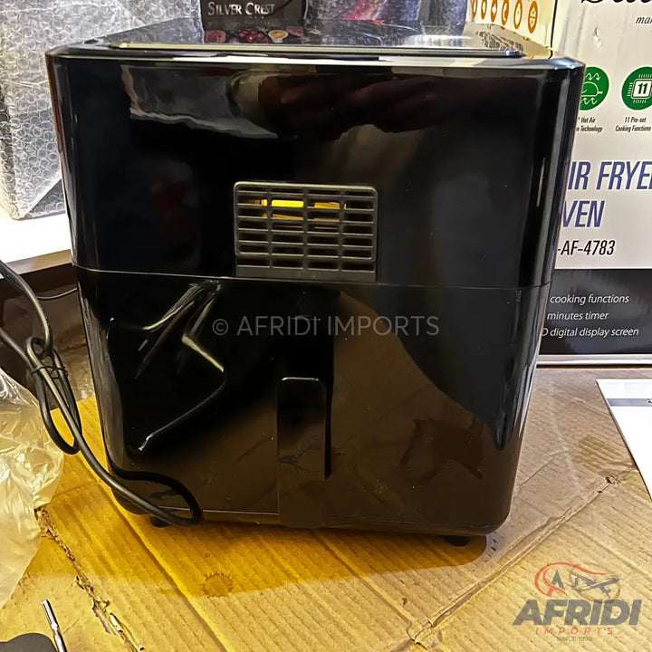 Black air fryer oven with digital display.