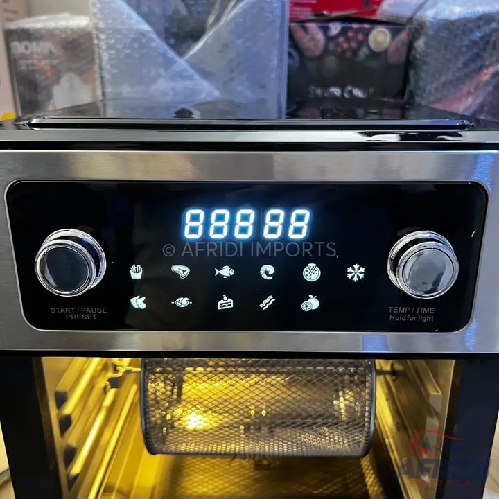 Stainless steel digital air fryer oven with a rotating basket.
