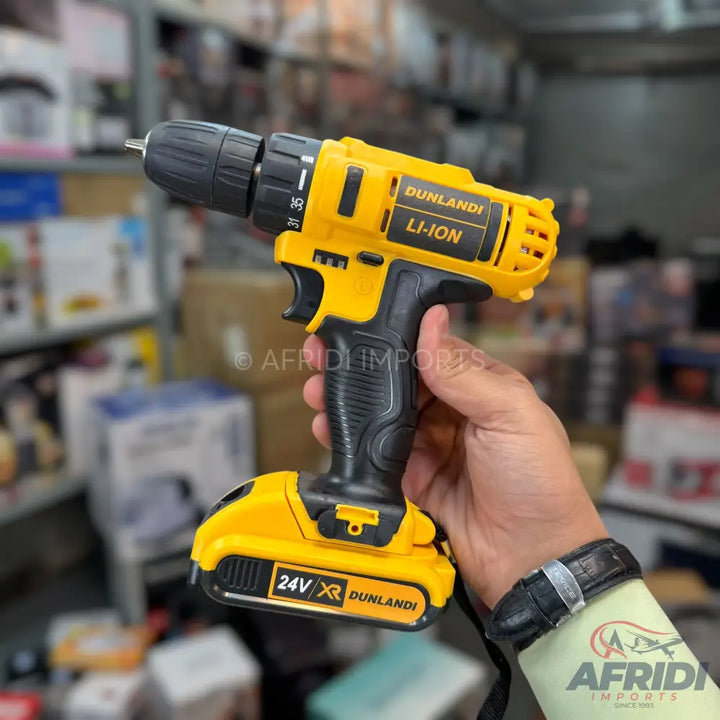 Yellow and black cordless drill with a lithium-ion battery.