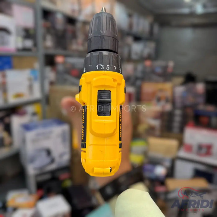 Yellow and black cordless drill with an adjustable chuck.