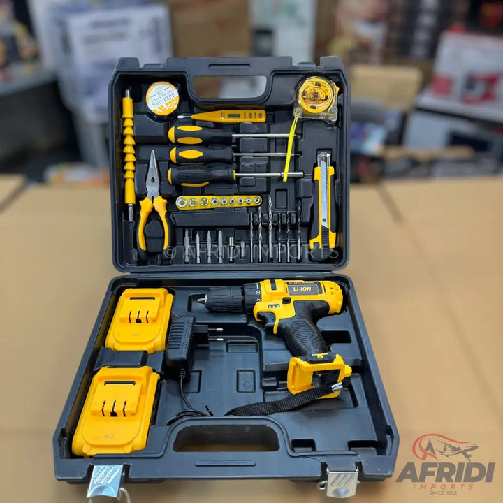 A comprehensive black and yellow tool kit with a cordless drill, two batteries, and various hand tools.
