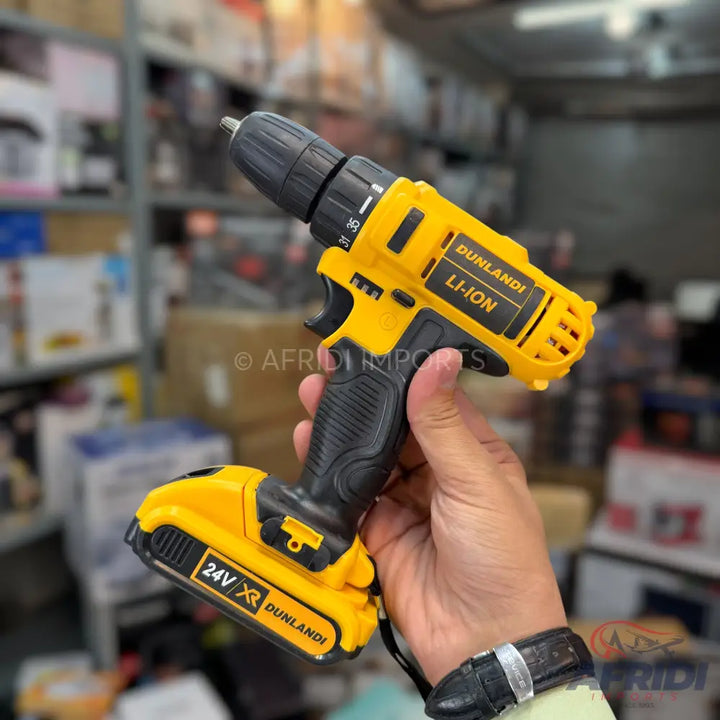Yellow and black cordless electric drill with a 24V Li-ion battery.