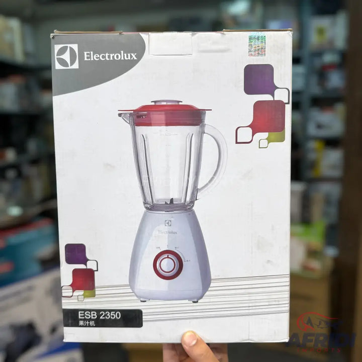 White Electrolux blender with a red lid and control knob.