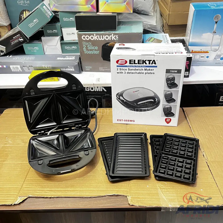 Black 2-slice sandwich maker with interchangeable grill and waffle plates.