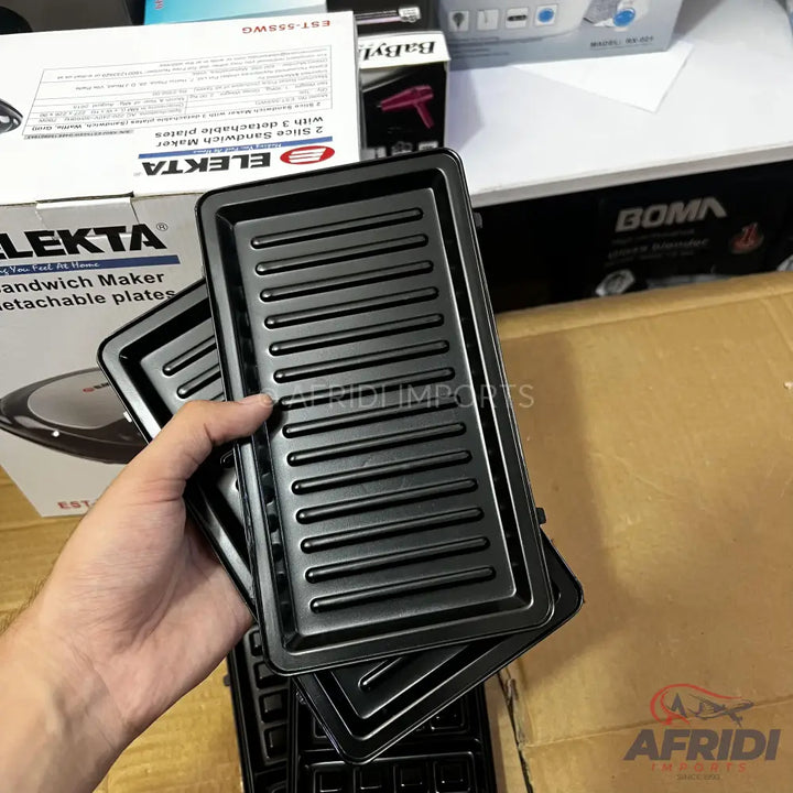 Black non-stick grill plates for a sandwich maker.