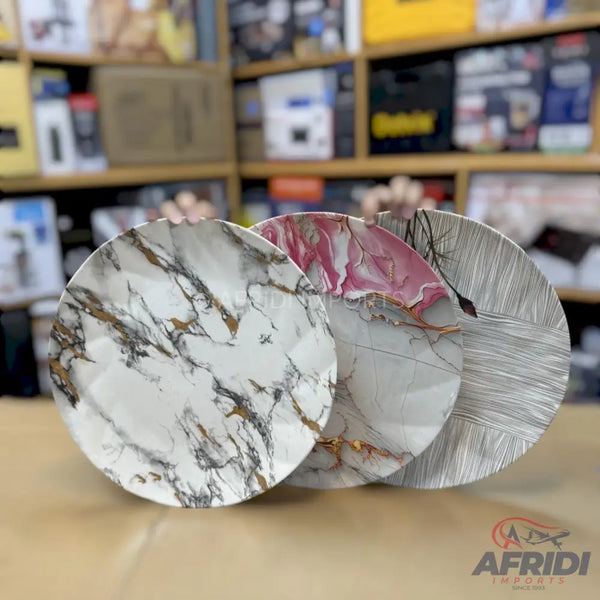 Three decorative plates with marble and abstract designs