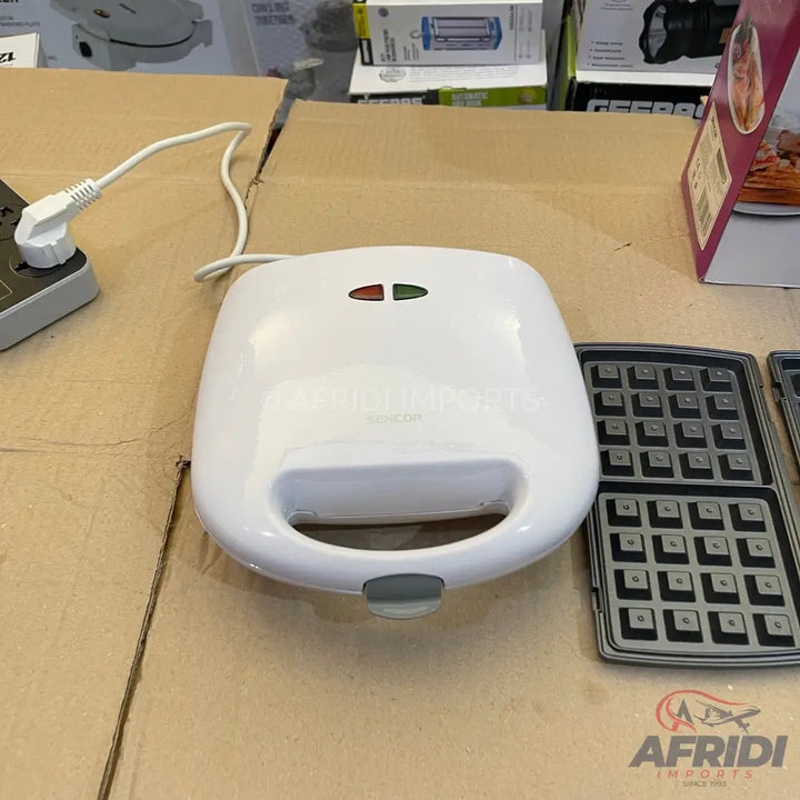 White waffle maker with removable cooking plates.