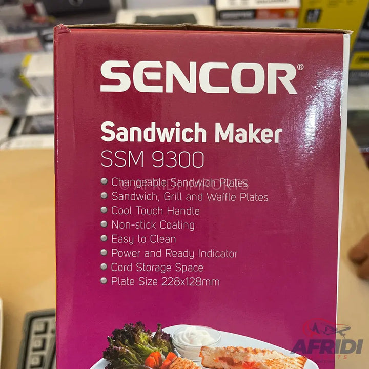 Sencor Sandwich Maker SSM 9300 with changeable sandwich, grill, and waffle plates, cool touch handle, non-stick coating, easy to clean, power and ready indicator, cord storage space, and plate size 228x128mm.