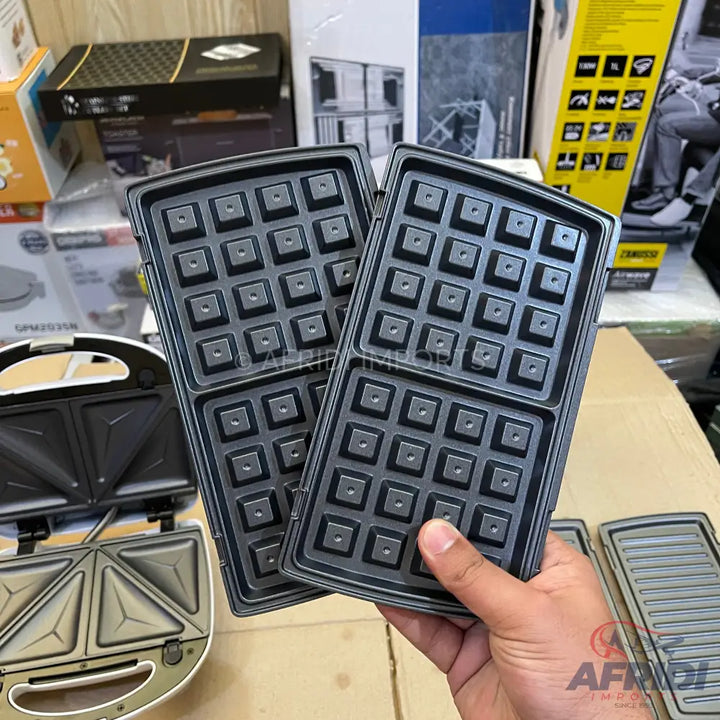 Interchangeable waffle iron and sandwich maker plates.