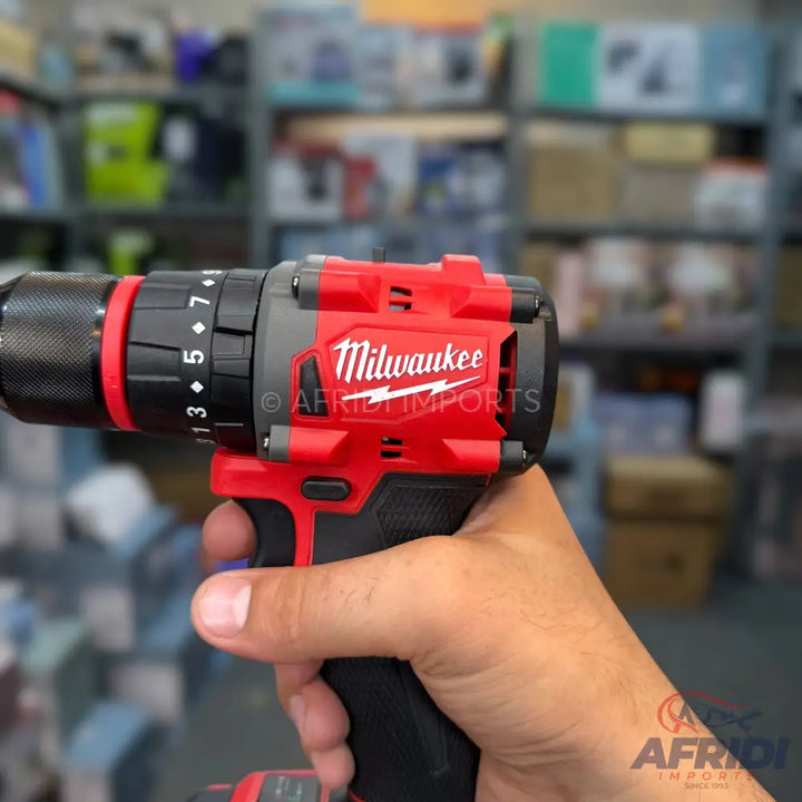 Red and black Milwaukee cordless drill with adjustable torque settings.