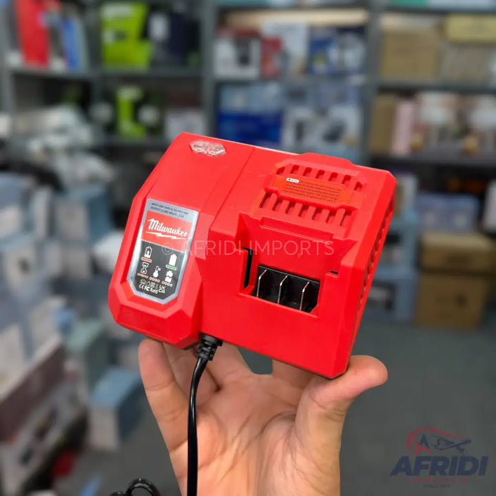 Red Milwaukee battery charger with a black power cord.