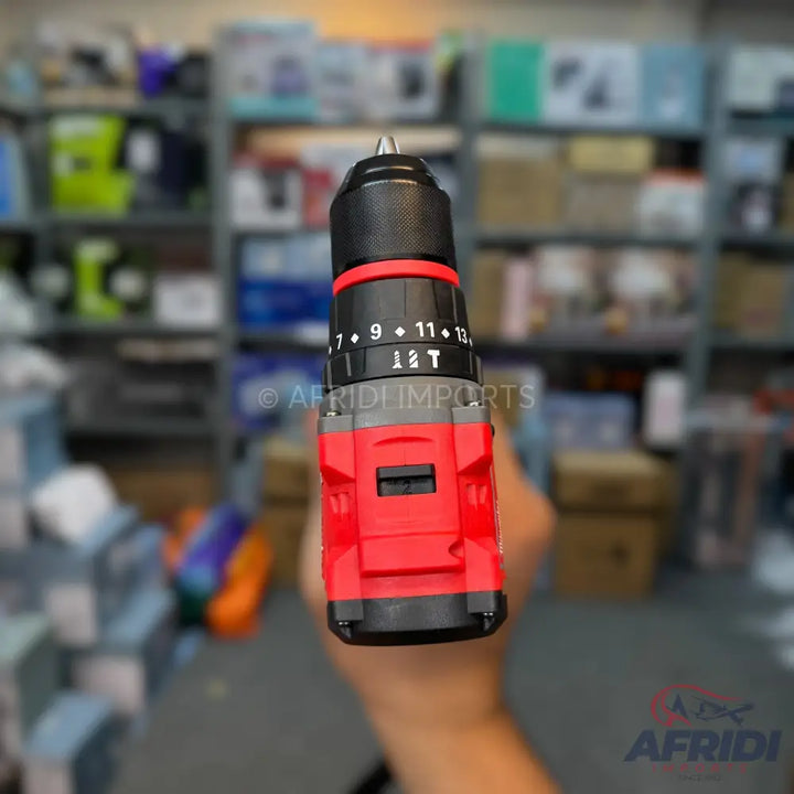Red and black cordless drill with a visible torque setting.