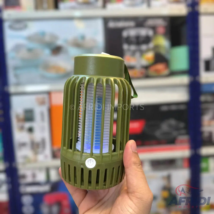 Green portable electric mosquito killer lamp with a blue light.