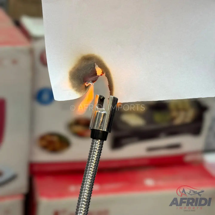 A flexible-necked electric arc lighter igniting a piece of paper.