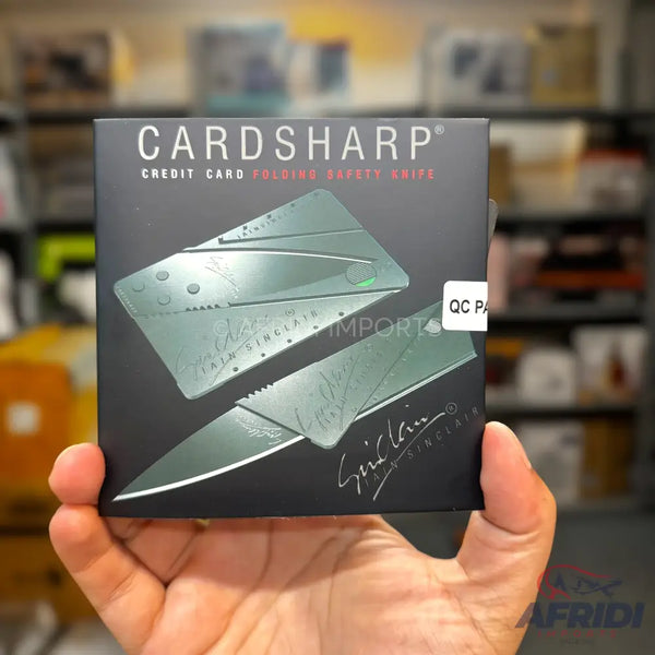 Black box packaging for a foldable credit card-sized safety knife.