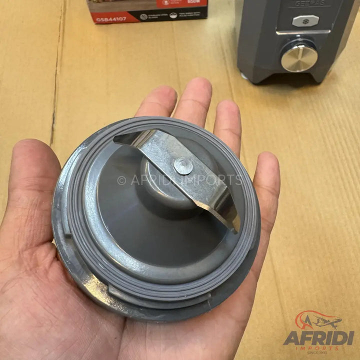 A gray blender blade assembly with a metal blade.