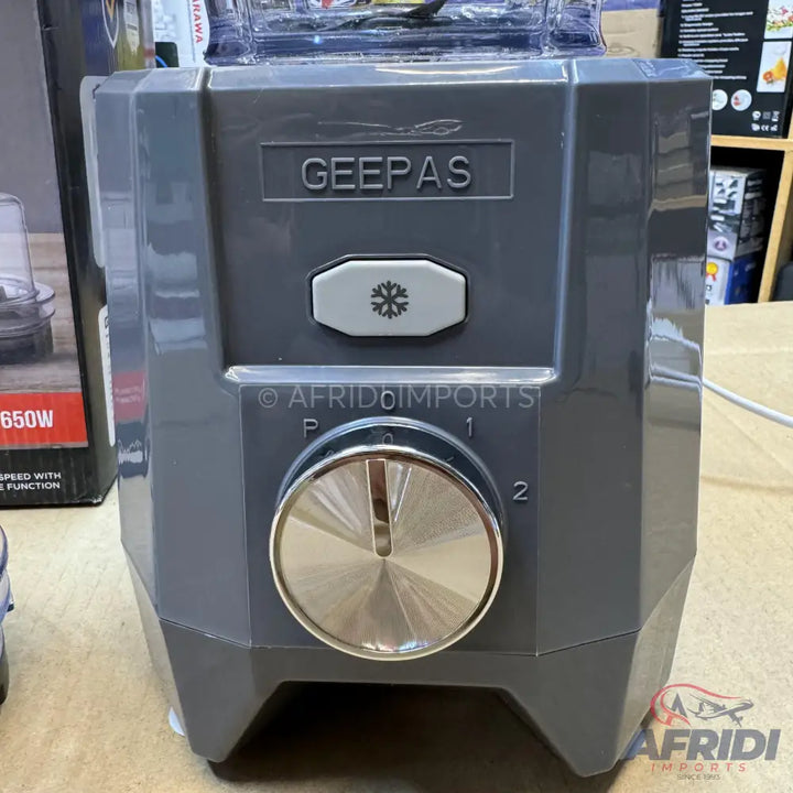 Gray blender base with a rotary dial and a snowflake button for ice crushing.