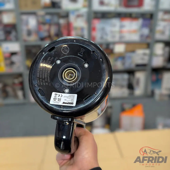 Black electric kettle with a circular base and a handle.
