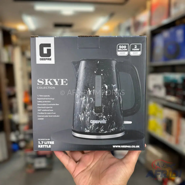 A black marble-patterned electric kettle with a 1.7-liter capacity.