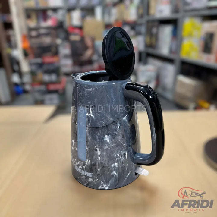 A dark gray electric kettle with a white marble-like pattern and an open lid.