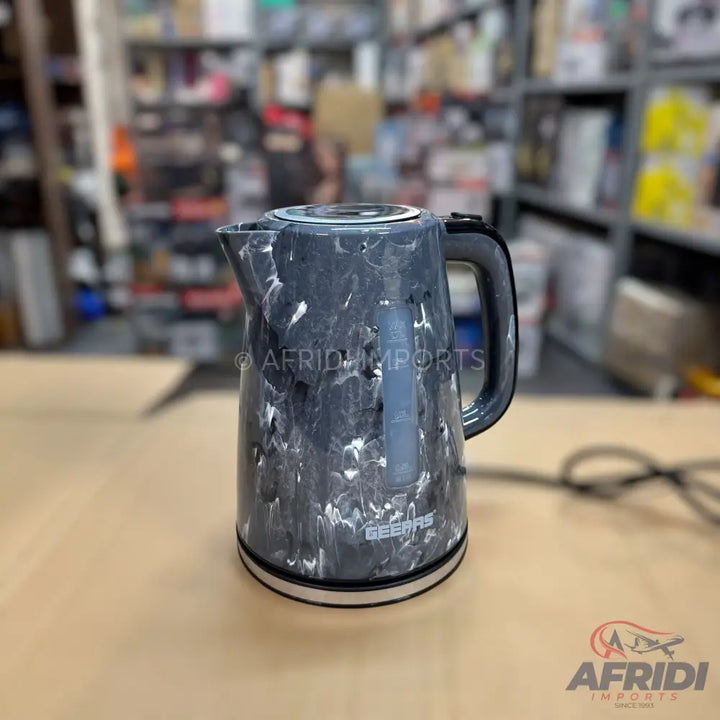 Black and white marble-patterned electric kettle with a water level indicator.