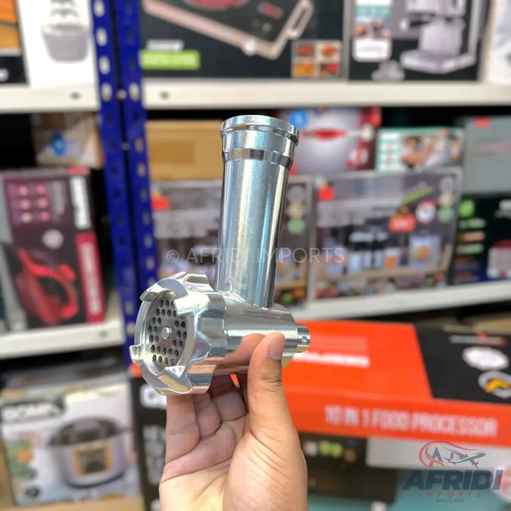 A metallic meat grinder attachment with a perforated plate.