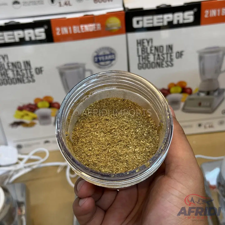 A clear plastic container filled with finely ground spices.