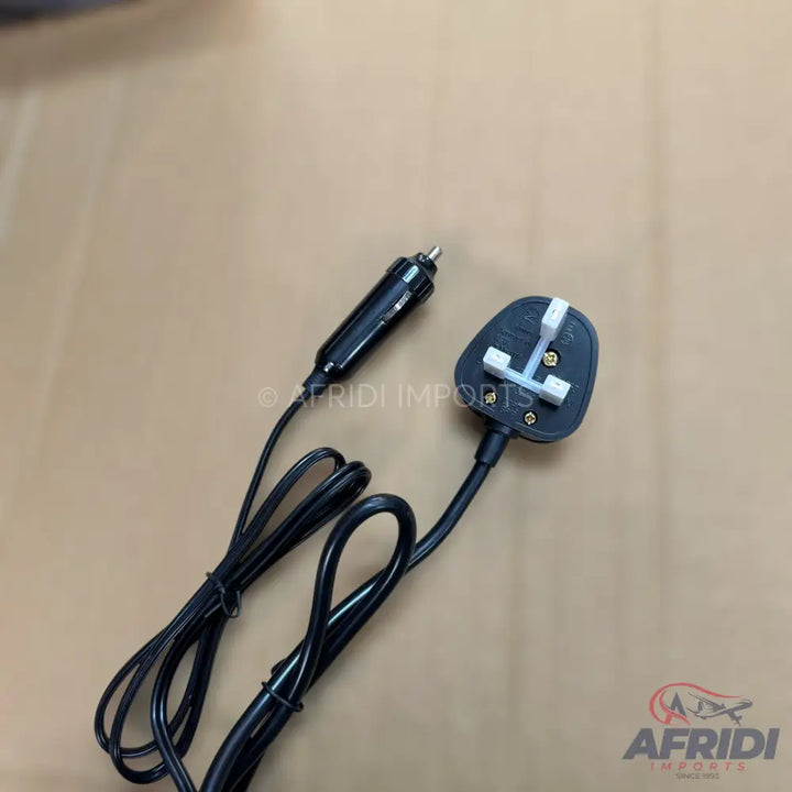 A black power cable with a car cigarette lighter plug on one end and a UK-style three-pin plug on the other.