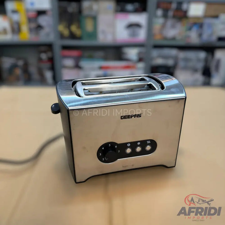 Stainless steel two-slice toaster with browning control and function buttons.