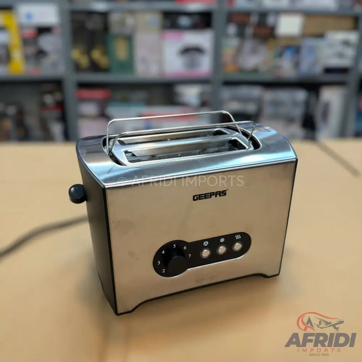 Stainless steel two-slice toaster with browning control and function buttons.