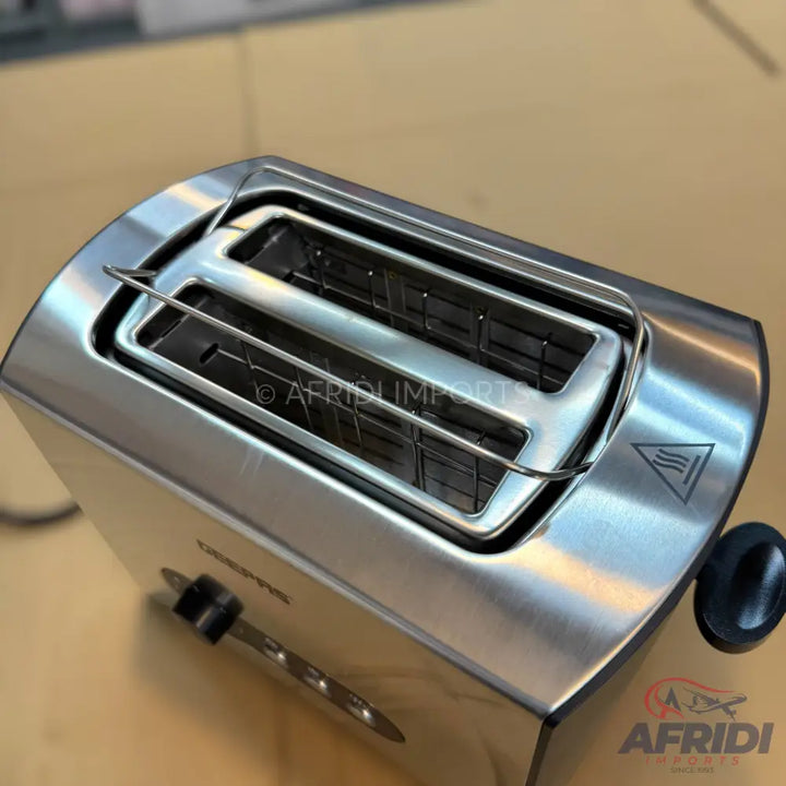 A stainless steel two-slice toaster with a warming rack.