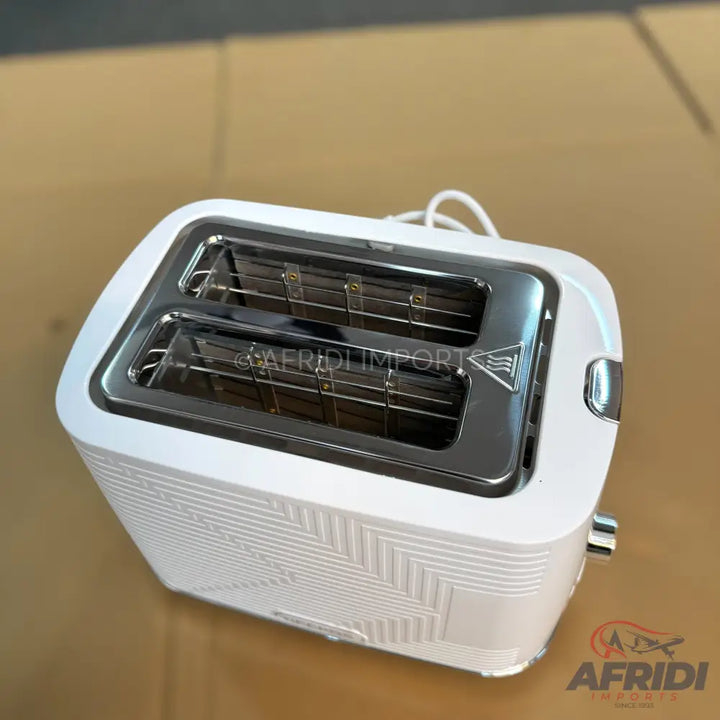 White two-slice toaster with a textured geometric pattern.