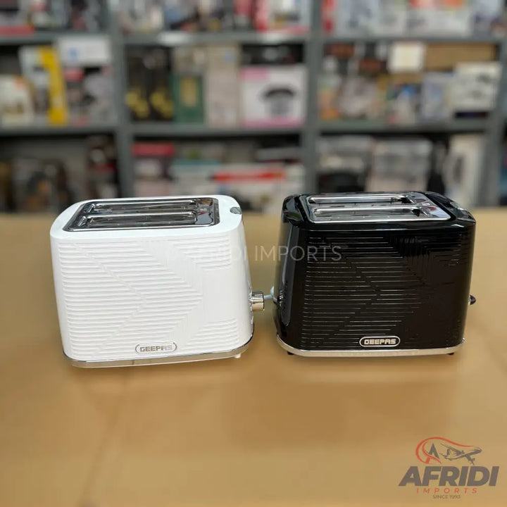 Two 2-slice toasters, one white and one black, with ribbed designs.