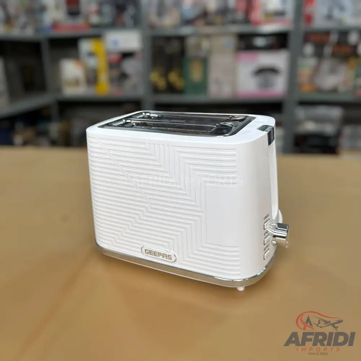 White toaster with a textured zig-zag pattern and two slots.