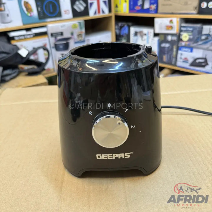 Black blender base with a silver control knob.